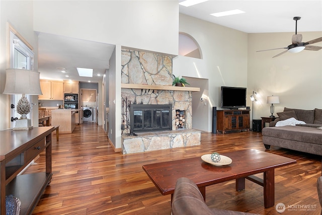 8 Far Summit Pl, Bellingham, WA 98229 - living area with washer / dryer, high vaulted ceiling, wood finished floors, ceiling fan, and a skylight