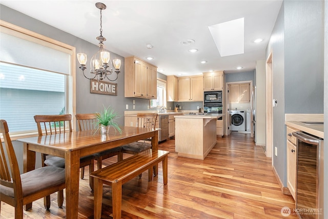 8 Far Summit Pl, Bellingham, WA 98229 - dining room with beverage cooler, a chandelier, light wood-type flooring, washing machine and dryer, and recessed lighting