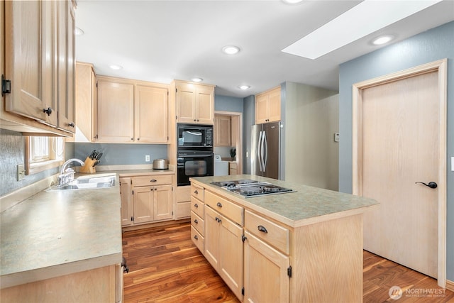 8 Far Summit Pl, Bellingham, WA 98229 - kitchen featuring light brown cabinetry, black appliances, a sink, light countertops, and recessed lighting