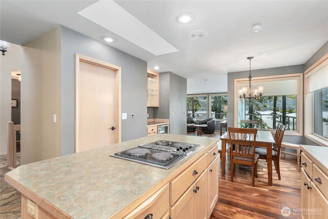 8 Far Summit Pl, Bellingham, WA 98229 - kitchen featuring black electric stovetop, light brown cabinetry, a chandelier, wood finished floors, and light countertops