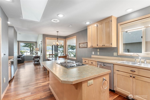 8 Far Summit Pl, Bellingham, WA 98229 - kitchen featuring dishwasher, light brown cabinetry, a sink, electric cooktop, and a chandelier