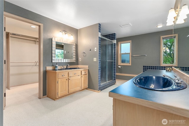 8 Far Summit Pl, Bellingham, WA 98229 - bathroom with vanity, a shower stall, healthy amount of natural light, and a walk in closet