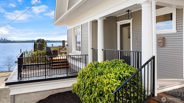3807 E Jefferson St, Seattle, WA 98122 - view of exterior entry with a water view and a porch