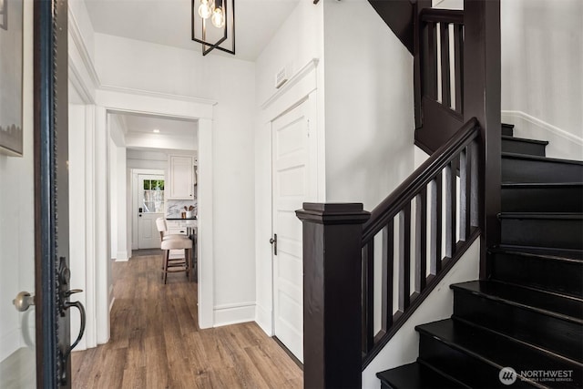 3807 E Jefferson St, Seattle, WA 98122 - entryway featuring wood finished floors, stairway, and baseboards