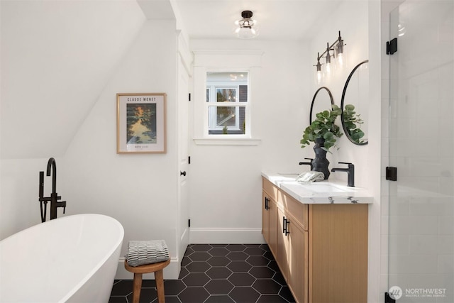 3807 E Jefferson St, Seattle, WA 98122 - full bathroom featuring a soaking tub, double vanity, tile patterned flooring, a tile shower, and baseboards