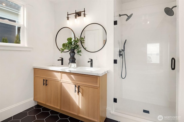 3807 E Jefferson St, Seattle, WA 98122 - full bathroom with a shower stall, double vanity, baseboards, and tile patterned floors
