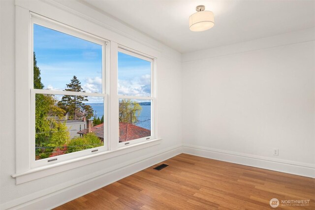 3807 E Jefferson St, Seattle, WA 98122 - spare room with wood finished floors and baseboards