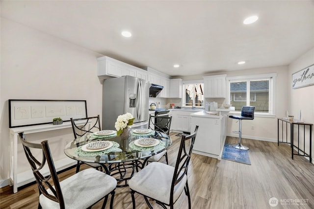 3604 22nd Ave W, Seattle, WA 98199 - dining space with light wood-style flooring, recessed lighting, and baseboards