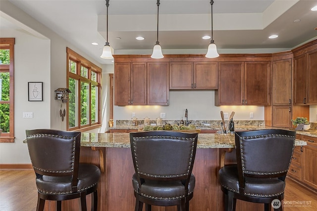 3430 Sevenich Dr, Everett, WA 98201 - kitchen featuring wood finished floors, recessed lighting, hanging light fixtures, and a kitchen island