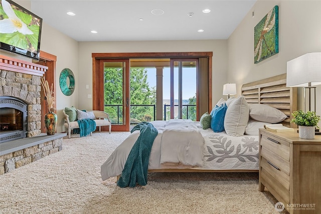 3430 Sevenich Dr, Everett, WA 98201 - bedroom with access to outside, recessed lighting, a stone fireplace, and carpet flooring