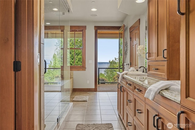 3430 Sevenich Dr, Everett, WA 98201 - full bathroom with double vanity, baseboards, tile patterned floors, and recessed lighting