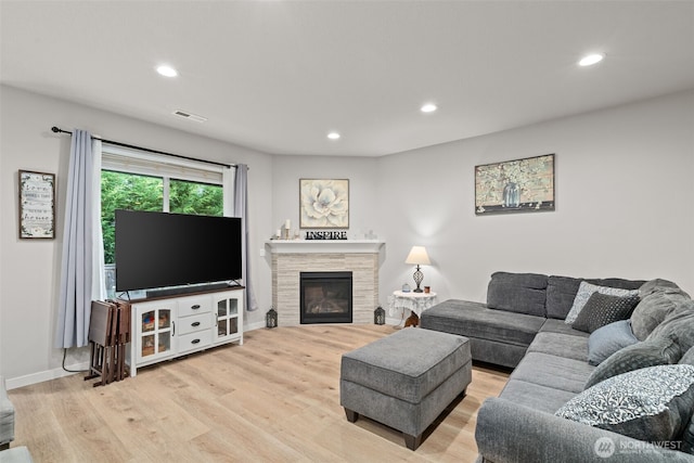 1116 NE 14th Way, Battle Ground, WA 98604 - living area with wood finished floors, recessed lighting, baseboards, and a tiled fireplace