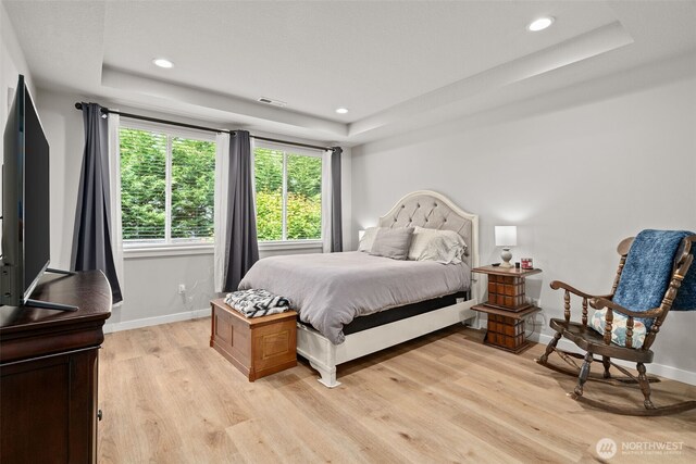 1116 NE 14th Way, Battle Ground, WA 98604 - bedroom featuring a tray ceiling, light wood-style flooring, baseboards, and recessed lighting