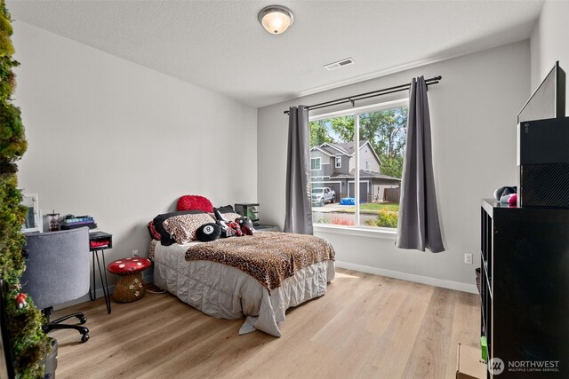 1116 NE 14th Way, Battle Ground, WA 98604 - bedroom featuring light wood-style flooring and baseboards