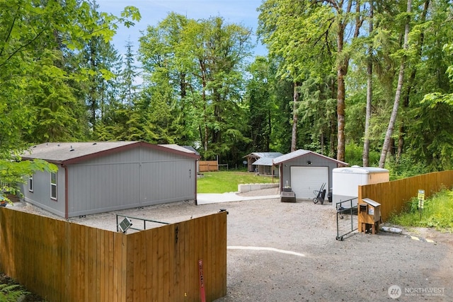 477 SE Old Arcadia Rd, Shelton, WA 98584 - view of yard featuring an outdoor structure and a detached garage