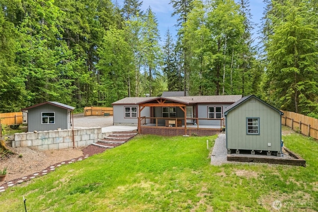 477 SE Old Arcadia Rd, Shelton, WA 98584 - rear view of property with an outdoor structure and a wooden deck