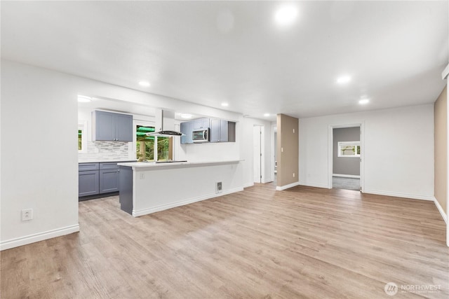 24028 135th Ave SE, Kent, WA 98042 - unfurnished living room with light wood-style flooring, recessed lighting, and baseboards