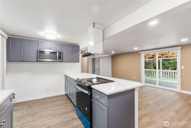 24028 135th Ave SE, Kent, WA 98042 - kitchen with stainless steel microwave, electric range oven, island exhaust hood, gray cabinetry, and a peninsula