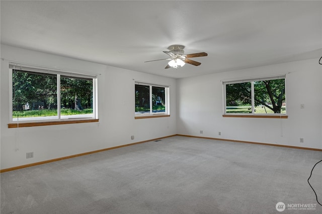 45019 284th Ave SE, Enumclaw, WA 98022 - spare room featuring ceiling fan, carpet flooring, and baseboards