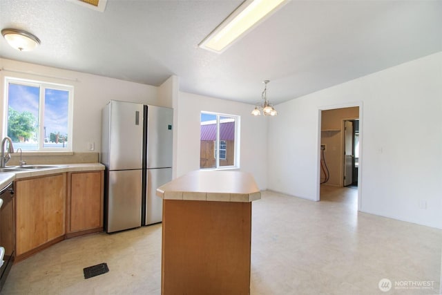 524 New Gate Dr, Prosser, WA 99350 - kitchen with freestanding refrigerator, light floors, and light countertops