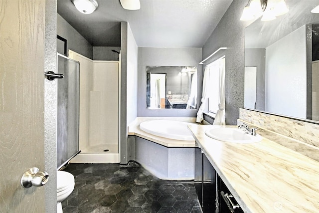 524 New Gate Dr, Prosser, WA 99350 - bathroom featuring a garden tub, a stall shower, vanity, and toilet