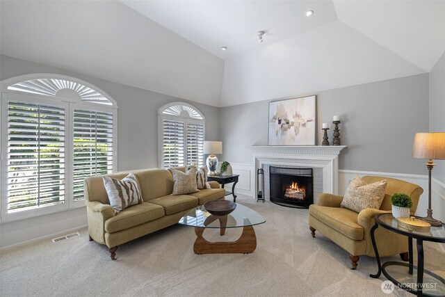 20520 NE 35th Pl, Sammamish, WA 98074 - carpeted living room with vaulted ceiling and a brick fireplace