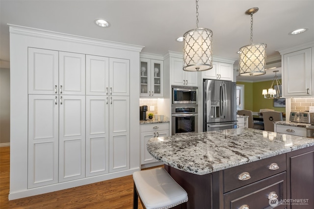 20520 NE 35th Pl, Sammamish, WA 98074 - kitchen featuring appliances with stainless steel finishes, white cabinets, tasteful backsplash, wood finished floors, and glass insert cabinets
