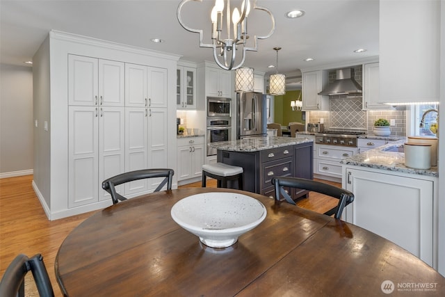 20520 NE 35th Pl, Sammamish, WA 98074 - dining space featuring a chandelier, recessed lighting, and light wood-style floors