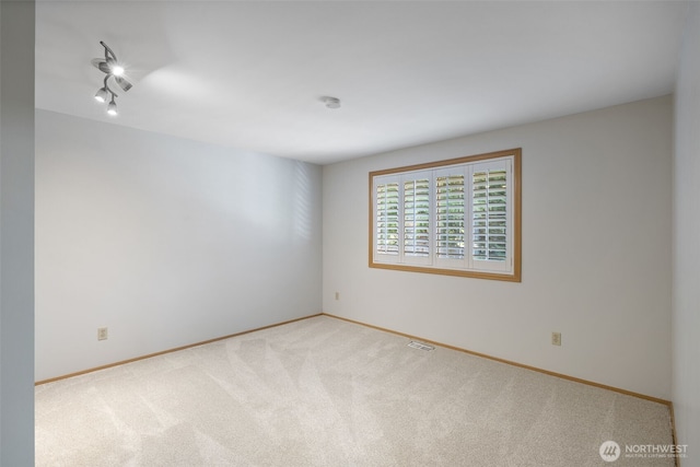 20520 NE 35th Pl, Sammamish, WA 98074 - spare room with carpet floors and track lighting