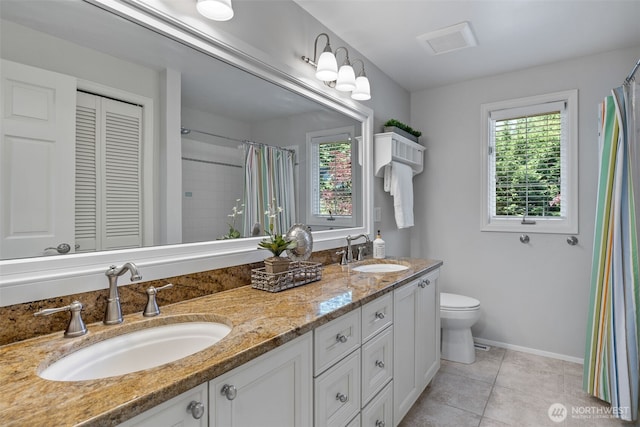20520 NE 35th Pl, Sammamish, WA 98074 - full bath with plenty of natural light, double vanity, tile patterned flooring, and a shower with curtain