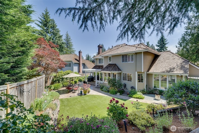 20520 NE 35th Pl, Sammamish, WA 98074 - back of property with a patio and a chimney