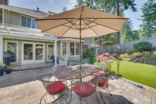 20520 NE 35th Pl, Sammamish, WA 98074 - fenced backyard featuring french doors, a patio, a pergola, and outdoor dining space