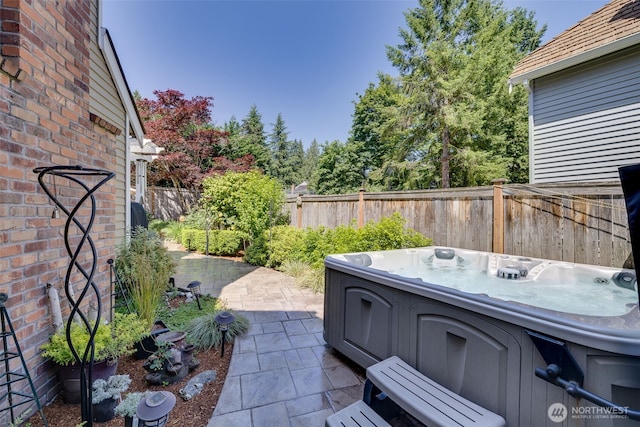 20520 NE 35th Pl, Sammamish, WA 98074 - fenced backyard featuring a hot tub and a patio area