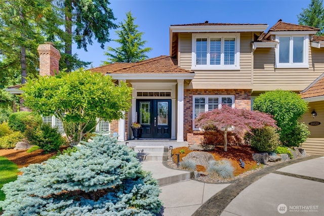 20520 NE 35th Pl, Sammamish, WA 98074 - view of front of home featuring brick siding and french doors