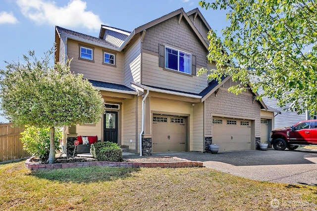 6715 Quincy Ave SE, Auburn, WA 98092 - craftsman-style home with asphalt driveway, a garage, and stone siding