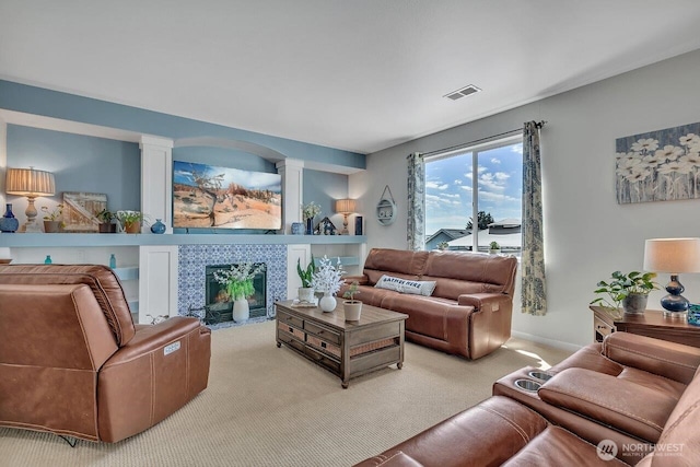 6715 Quincy Ave SE, Auburn, WA 98092 - living area featuring carpet floors, ornate columns, and a fireplace