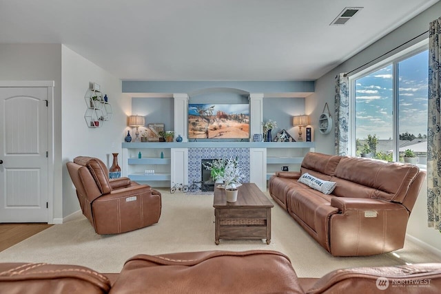 6715 Quincy Ave SE, Auburn, WA 98092 - living room featuring baseboards, ornate columns, and a tile fireplace