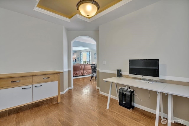 6715 Quincy Ave SE, Auburn, WA 98092 - office with a tray ceiling, arched walkways, light wood-type flooring, crown molding, and baseboards