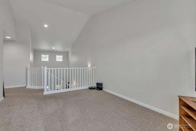 6715 Quincy Ave SE, Auburn, WA 98092 - spare room with lofted ceiling, carpet flooring, baseboards, and recessed lighting