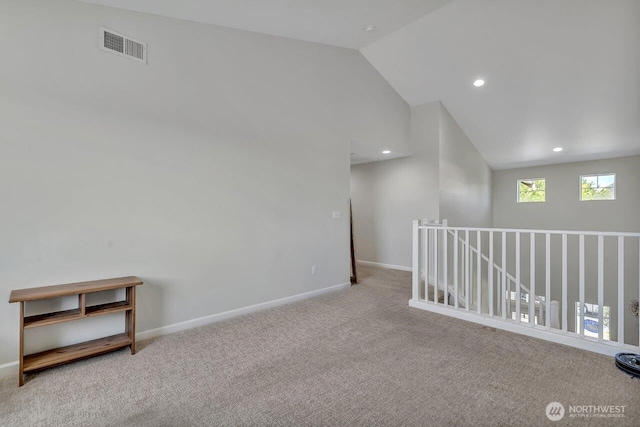 6715 Quincy Ave SE, Auburn, WA 98092 - empty room featuring carpet, vaulted ceiling, baseboards, and recessed lighting
