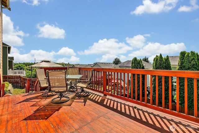 6715 Quincy Ave SE, Auburn, WA 98092 - wooden terrace with outdoor dining area