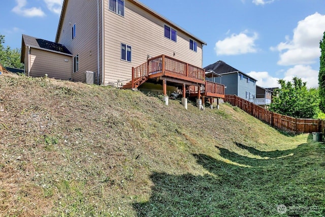 6715 Quincy Ave SE, Auburn, WA 98092 - back of property with a wooden deck and cooling unit