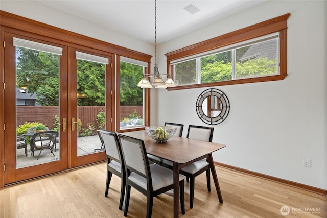 2728 206th Ter NE, Sammamish, WA 98074 - dining space with plenty of natural light, french doors, and light wood-style floors