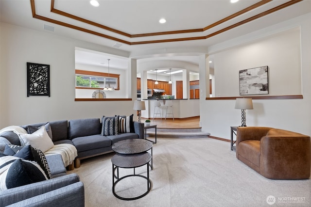 2728 206th Ter NE, Sammamish, WA 98074 - carpeted living room featuring ornamental molding, a raised ceiling, recessed lighting, and arched walkways