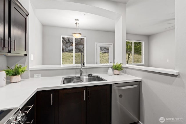 1900 Weaver Rd Unit C106, Snohomish, WA 98290 - kitchen featuring stainless steel appliances, light countertops, dark brown cabinetry, and a peninsula