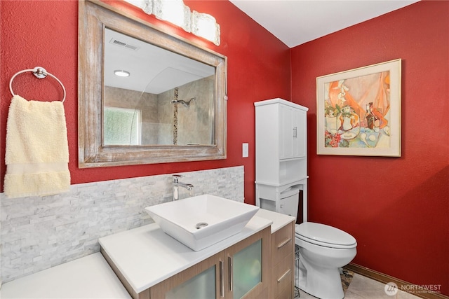3318 18th Ave SE, Olympia, WA 98501 - bathroom featuring vanity, toilet, tile patterned flooring, and a shower
