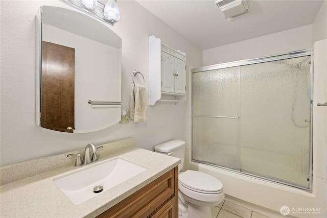 3318 18th Ave SE, Olympia, WA 98501 - bathroom featuring vanity, toilet, bath / shower combo with glass door, and tile patterned flooring