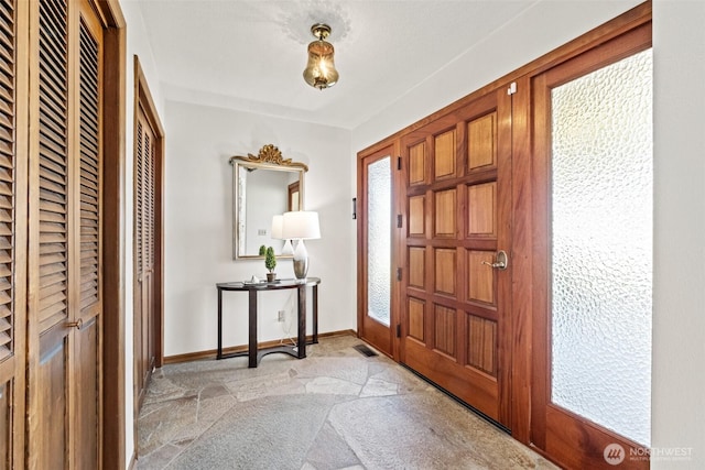 742 I St SW, Quincy, WA 98848 - foyer entrance with a heating unit and baseboards