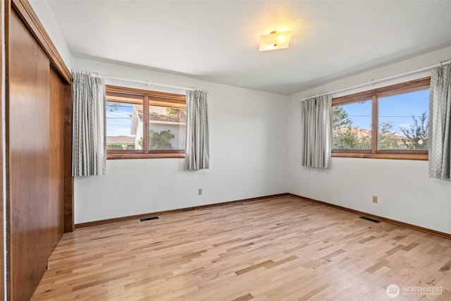 742 I St SW, Quincy, WA 98848 - unfurnished bedroom featuring light wood-style flooring, baseboards, and a closet