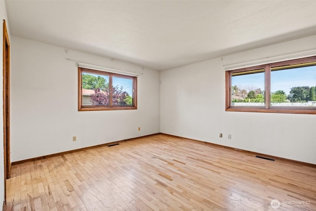 742 I St SW, Quincy, WA 98848 - spare room with healthy amount of natural light, light wood-style flooring, and baseboards
